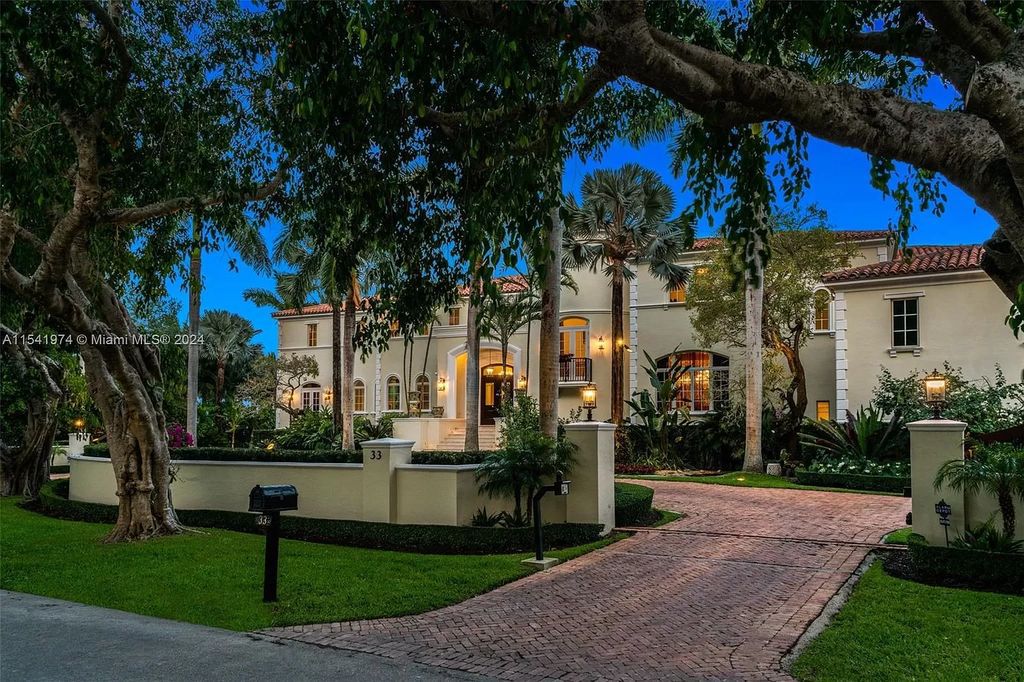 Nestled within the prestigious guard-gated community of Gables Estates, 33 Arvida Parkway presents a magnificent 14,972-square-foot estate boasting 225 feet of waterfront on a lushly landscaped 35,389-square-foot lot.