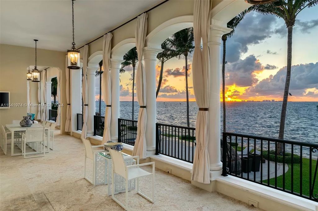 Nestled within the prestigious guard-gated community of Gables Estates, 33 Arvida Parkway presents a magnificent 14,972-square-foot estate boasting 225 feet of waterfront on a lushly landscaped 35,389-square-foot lot.