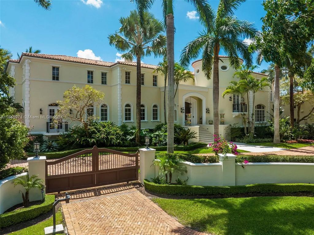 Nestled within the prestigious guard-gated community of Gables Estates, 33 Arvida Parkway presents a magnificent 14,972-square-foot estate boasting 225 feet of waterfront on a lushly landscaped 35,389-square-foot lot.