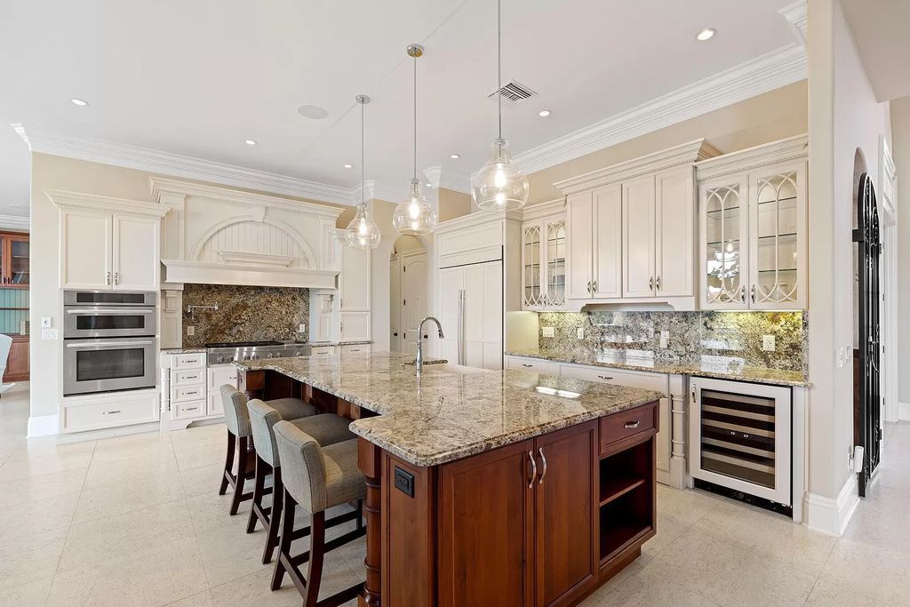 Experience unparalleled luxury living at this waterfront estate in Tigertail/Collier Bay, Marco Island. Boasting over $400,000 in price reduction, this multi-level home features a private elevator, 6 bedrooms, 7 bathrooms, 2 living rooms, a den, and a formal dining room, spanning just over 6,500 square feet of living space.