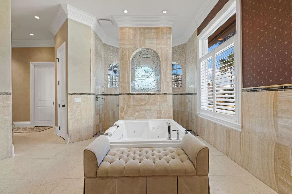 Experience unparalleled luxury living at this waterfront estate in Tigertail/Collier Bay, Marco Island. Boasting over $400,000 in price reduction, this multi-level home features a private elevator, 6 bedrooms, 7 bathrooms, 2 living rooms, a den, and a formal dining room, spanning just over 6,500 square feet of living space.