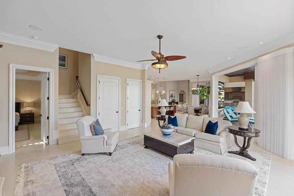 Experience unparalleled luxury living at this waterfront estate in Tigertail/Collier Bay, Marco Island. Boasting over $400,000 in price reduction, this multi-level home features a private elevator, 6 bedrooms, 7 bathrooms, 2 living rooms, a den, and a formal dining room, spanning just over 6,500 square feet of living space.