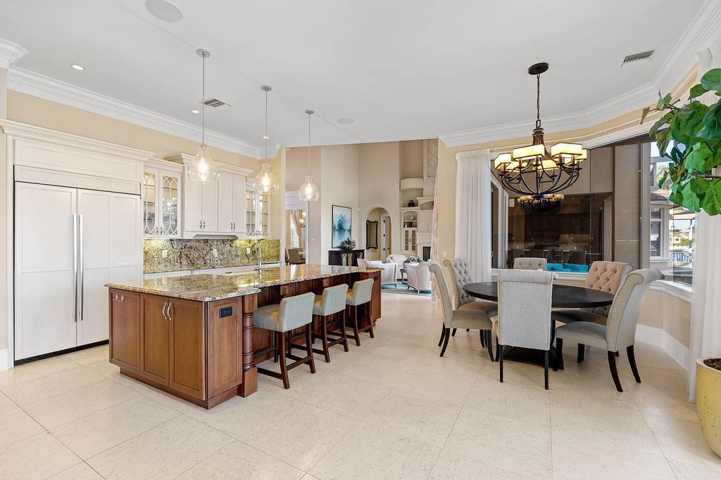 Experience unparalleled luxury living at this waterfront estate in Tigertail/Collier Bay, Marco Island. Boasting over $400,000 in price reduction, this multi-level home features a private elevator, 6 bedrooms, 7 bathrooms, 2 living rooms, a den, and a formal dining room, spanning just over 6,500 square feet of living space.