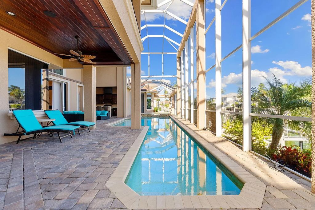 Experience unparalleled luxury living at this waterfront estate in Tigertail/Collier Bay, Marco Island. Boasting over $400,000 in price reduction, this multi-level home features a private elevator, 6 bedrooms, 7 bathrooms, 2 living rooms, a den, and a formal dining room, spanning just over 6,500 square feet of living space.