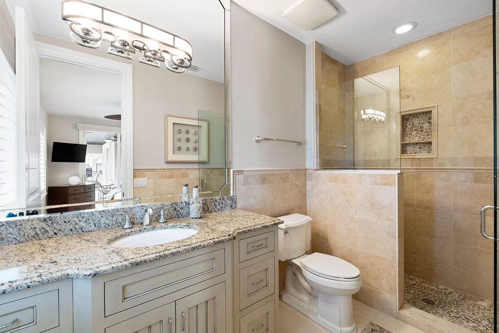 Experience unparalleled luxury living at this waterfront estate in Tigertail/Collier Bay, Marco Island. Boasting over $400,000 in price reduction, this multi-level home features a private elevator, 6 bedrooms, 7 bathrooms, 2 living rooms, a den, and a formal dining room, spanning just over 6,500 square feet of living space.