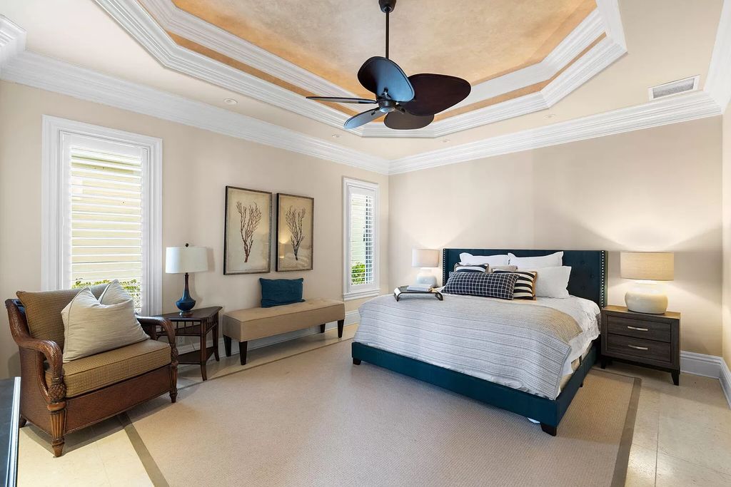 Experience unparalleled luxury living at this waterfront estate in Tigertail/Collier Bay, Marco Island. Boasting over $400,000 in price reduction, this multi-level home features a private elevator, 6 bedrooms, 7 bathrooms, 2 living rooms, a den, and a formal dining room, spanning just over 6,500 square feet of living space.