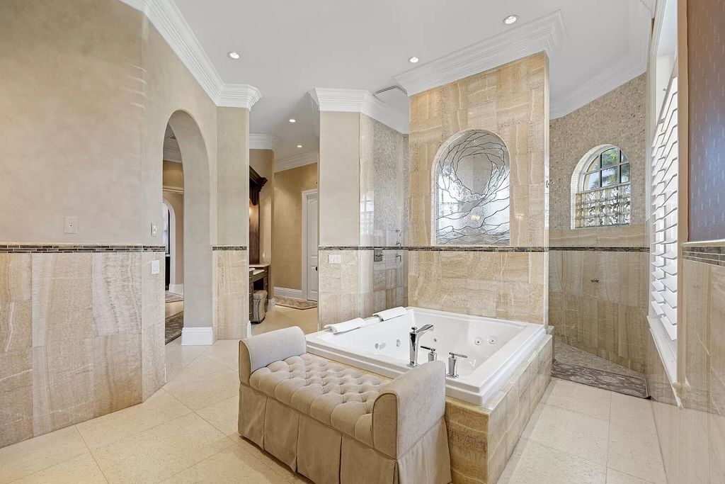 Experience unparalleled luxury living at this waterfront estate in Tigertail/Collier Bay, Marco Island. Boasting over $400,000 in price reduction, this multi-level home features a private elevator, 6 bedrooms, 7 bathrooms, 2 living rooms, a den, and a formal dining room, spanning just over 6,500 square feet of living space.