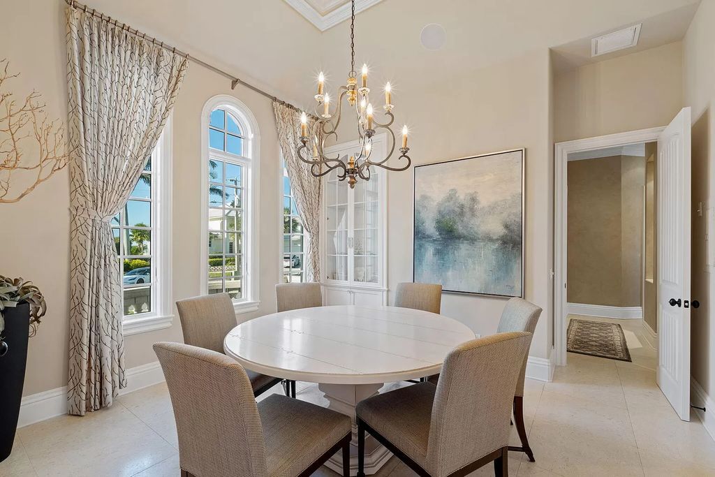 Experience unparalleled luxury living at this waterfront estate in Tigertail/Collier Bay, Marco Island. Boasting over $400,000 in price reduction, this multi-level home features a private elevator, 6 bedrooms, 7 bathrooms, 2 living rooms, a den, and a formal dining room, spanning just over 6,500 square feet of living space.