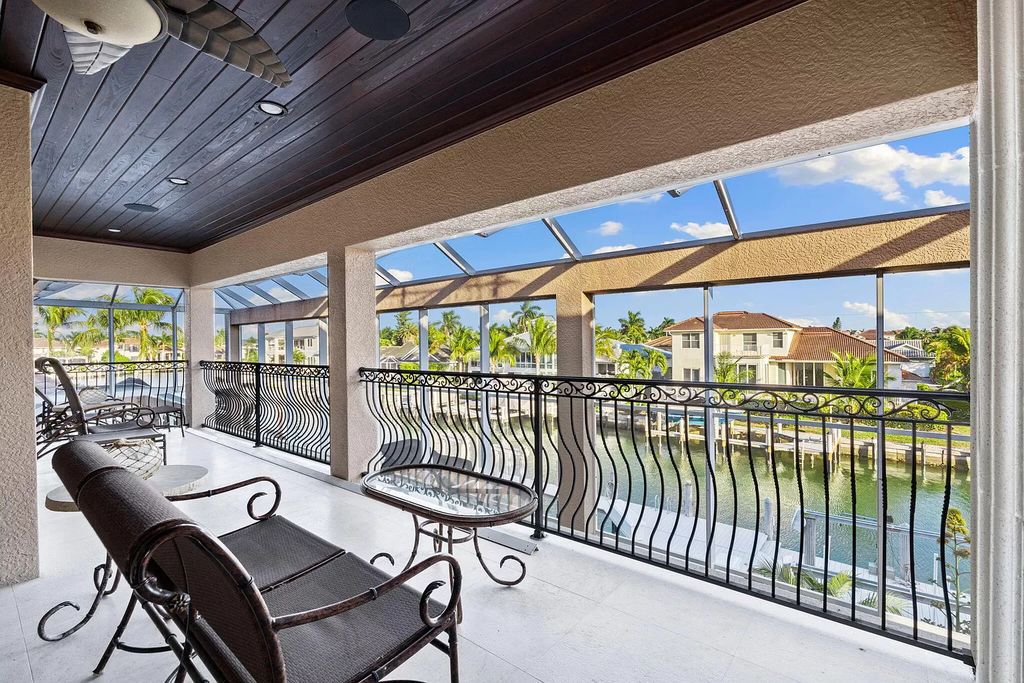 Experience unparalleled luxury living at this waterfront estate in Tigertail/Collier Bay, Marco Island. Boasting over $400,000 in price reduction, this multi-level home features a private elevator, 6 bedrooms, 7 bathrooms, 2 living rooms, a den, and a formal dining room, spanning just over 6,500 square feet of living space.