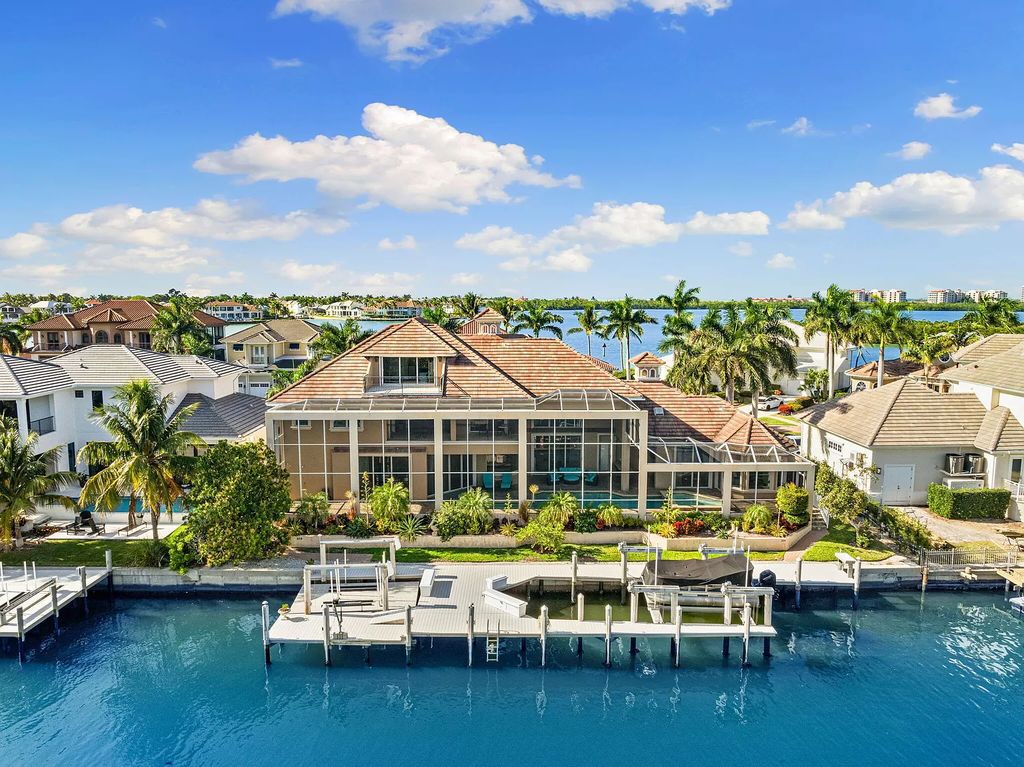 Experience unparalleled luxury living at this waterfront estate in Tigertail/Collier Bay, Marco Island. Boasting over $400,000 in price reduction, this multi-level home features a private elevator, 6 bedrooms, 7 bathrooms, 2 living rooms, a den, and a formal dining room, spanning just over 6,500 square feet of living space.