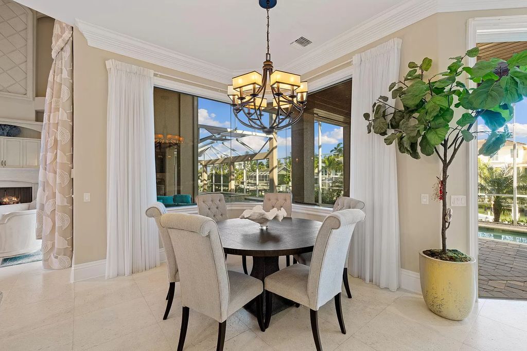 Experience unparalleled luxury living at this waterfront estate in Tigertail/Collier Bay, Marco Island. Boasting over $400,000 in price reduction, this multi-level home features a private elevator, 6 bedrooms, 7 bathrooms, 2 living rooms, a den, and a formal dining room, spanning just over 6,500 square feet of living space.
