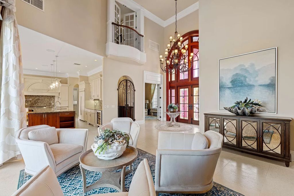 Experience unparalleled luxury living at this waterfront estate in Tigertail/Collier Bay, Marco Island. Boasting over $400,000 in price reduction, this multi-level home features a private elevator, 6 bedrooms, 7 bathrooms, 2 living rooms, a den, and a formal dining room, spanning just over 6,500 square feet of living space.