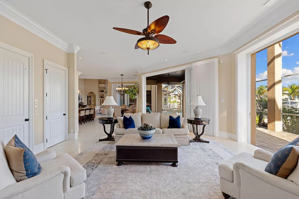 Experience unparalleled luxury living at this waterfront estate in Tigertail/Collier Bay, Marco Island. Boasting over $400,000 in price reduction, this multi-level home features a private elevator, 6 bedrooms, 7 bathrooms, 2 living rooms, a den, and a formal dining room, spanning just over 6,500 square feet of living space.
