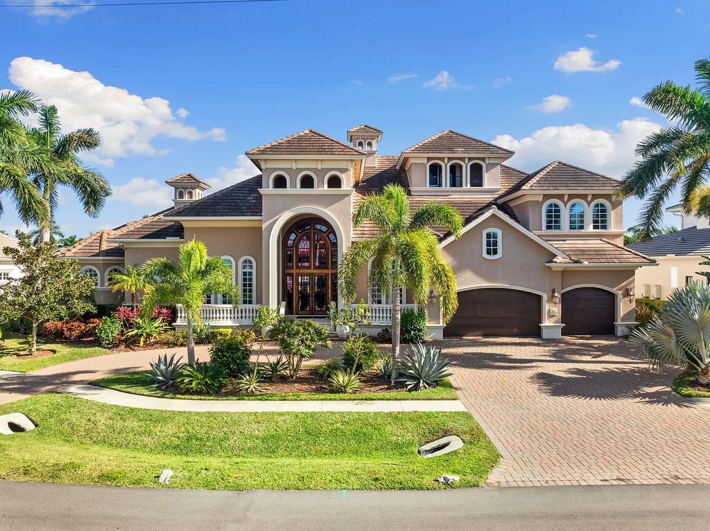 Experience unparalleled luxury living at this waterfront estate in Tigertail/Collier Bay, Marco Island. Boasting over $400,000 in price reduction, this multi-level home features a private elevator, 6 bedrooms, 7 bathrooms, 2 living rooms, a den, and a formal dining room, spanning just over 6,500 square feet of living space.