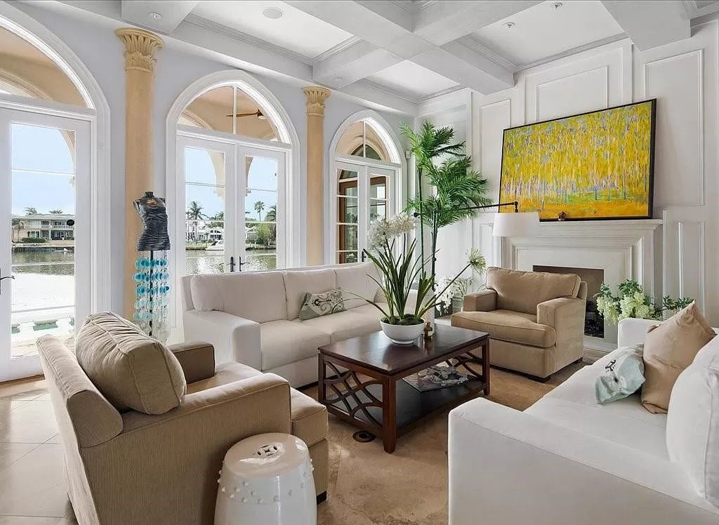 Indulge in the epitome of luxury waterfront living at this magnificent Naples estate on 210 Cuddy Ct. Crafted by Kurtz Homes, this opulent residence boasts grand columns, exquisite tile flooring, and coffered ceilings, flooded with natural light.