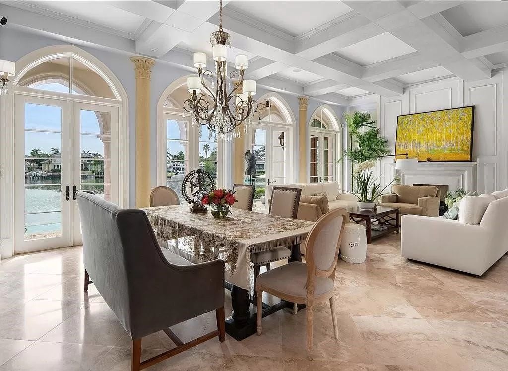 Indulge in the epitome of luxury waterfront living at this magnificent Naples estate on 210 Cuddy Ct. Crafted by Kurtz Homes, this opulent residence boasts grand columns, exquisite tile flooring, and coffered ceilings, flooded with natural light.