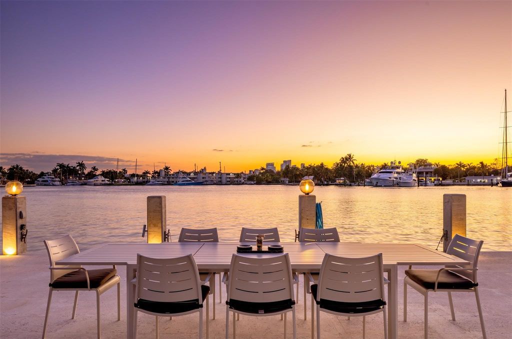 Rebuilt in July 2023, this single-story smart home offers 5,073 square feet of sophisticated living space on a sprawling 15,300-square-foot lot with a 2,300-square-foot dock adorned with coral stone from Spain.