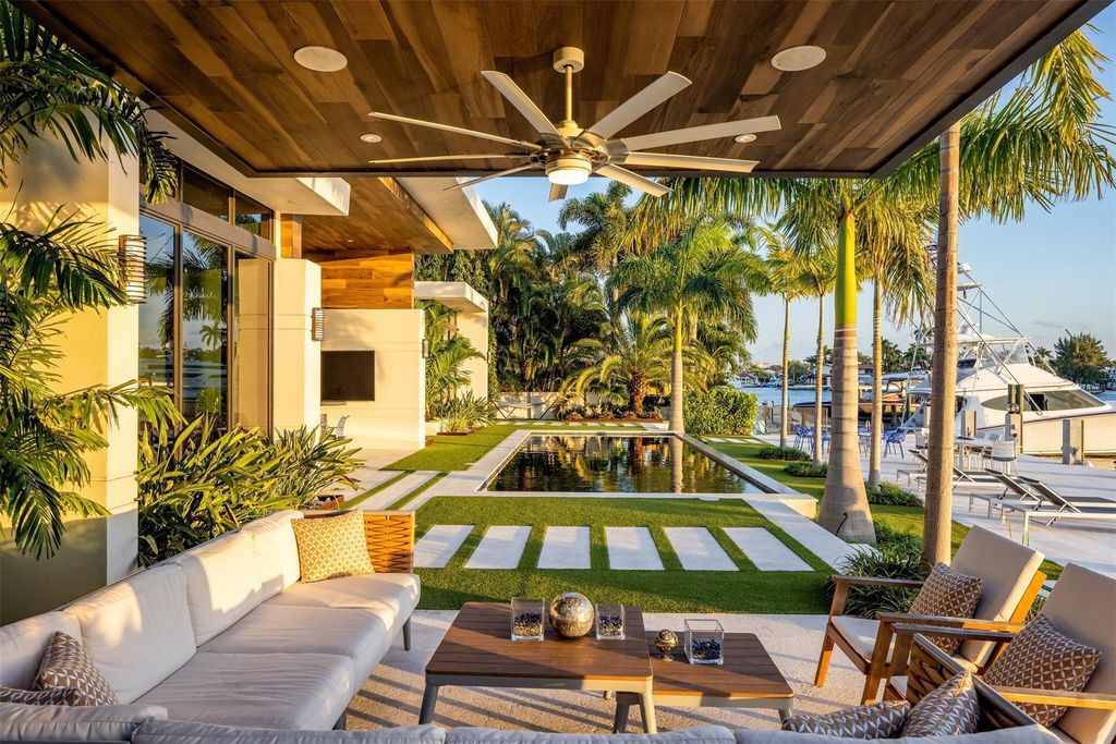 Rebuilt in July 2023, this single-story smart home offers 5,073 square feet of sophisticated living space on a sprawling 15,300-square-foot lot with a 2,300-square-foot dock adorned with coral stone from Spain.