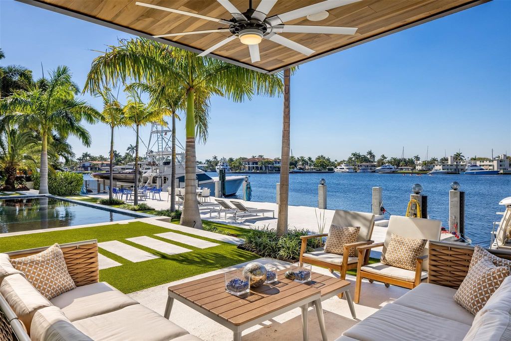Rebuilt in July 2023, this single-story smart home offers 5,073 square feet of sophisticated living space on a sprawling 15,300-square-foot lot with a 2,300-square-foot dock adorned with coral stone from Spain.