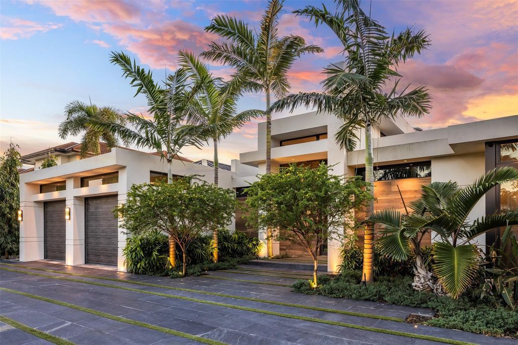 Rebuilt in July 2023, this single-story smart home offers 5,073 square feet of sophisticated living space on a sprawling 15,300-square-foot lot with a 2,300-square-foot dock adorned with coral stone from Spain.