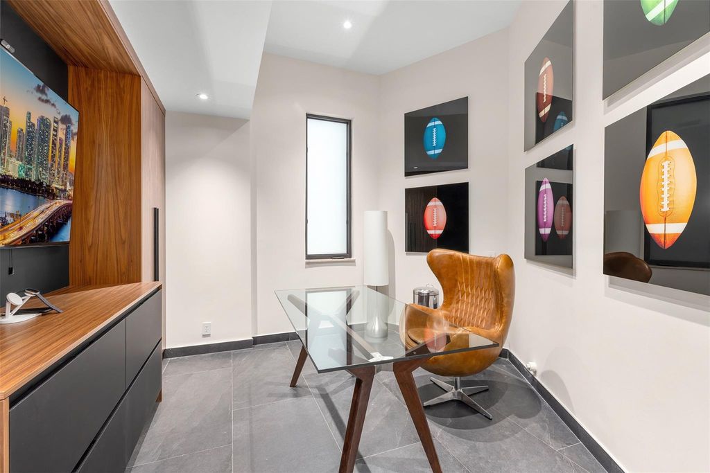 Rebuilt in July 2023, this single-story smart home offers 5,073 square feet of sophisticated living space on a sprawling 15,300-square-foot lot with a 2,300-square-foot dock adorned with coral stone from Spain.