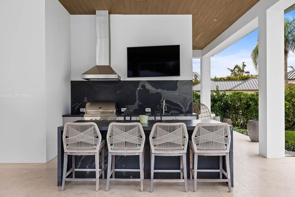 Nestled on the scenic Loxahatchee River, this 5-bedroom, 6-bathroom estate in Jupiter, Florida offers the epitome of luxury living.