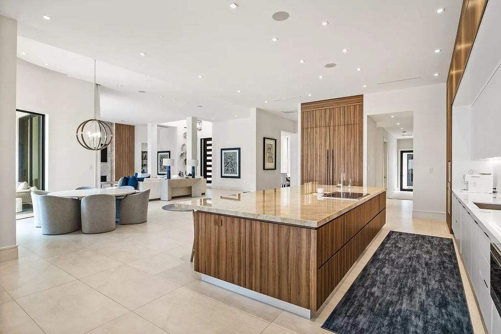 Nestled on the scenic Loxahatchee River, this 5-bedroom, 6-bathroom estate in Jupiter, Florida offers the epitome of luxury living.