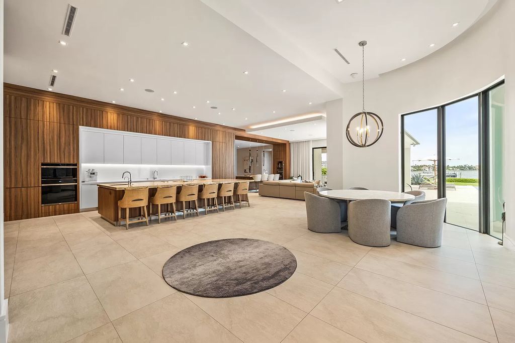 Nestled on the scenic Loxahatchee River, this 5-bedroom, 6-bathroom estate in Jupiter, Florida offers the epitome of luxury living.