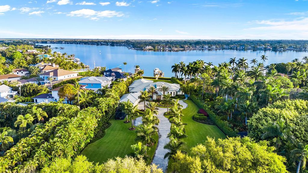 Nestled on the scenic Loxahatchee River, this 5-bedroom, 6-bathroom estate in Jupiter, Florida offers the epitome of luxury living.