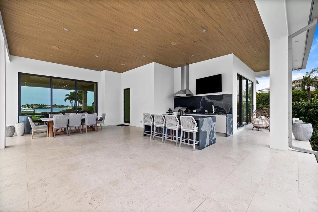 Nestled on the scenic Loxahatchee River, this 5-bedroom, 6-bathroom estate in Jupiter, Florida offers the epitome of luxury living.
