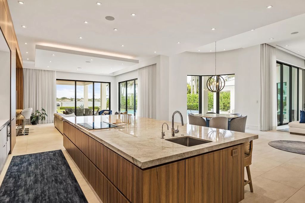 Nestled on the scenic Loxahatchee River, this 5-bedroom, 6-bathroom estate in Jupiter, Florida offers the epitome of luxury living.