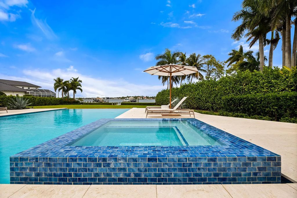 Nestled on the scenic Loxahatchee River, this 5-bedroom, 6-bathroom estate in Jupiter, Florida offers the epitome of luxury living.