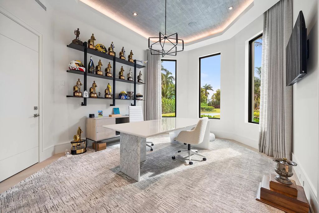 Nestled on the scenic Loxahatchee River, this 5-bedroom, 6-bathroom estate in Jupiter, Florida offers the epitome of luxury living.