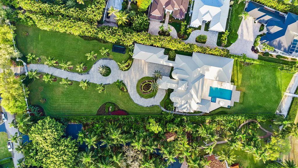 Nestled on the scenic Loxahatchee River, this 5-bedroom, 6-bathroom estate in Jupiter, Florida offers the epitome of luxury living.