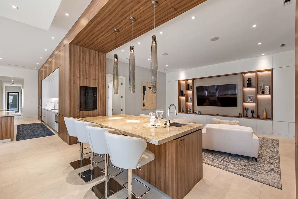Nestled on the scenic Loxahatchee River, this 5-bedroom, 6-bathroom estate in Jupiter, Florida offers the epitome of luxury living.