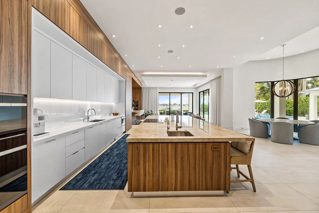 Nestled on the scenic Loxahatchee River, this 5-bedroom, 6-bathroom estate in Jupiter, Florida offers the epitome of luxury living.
