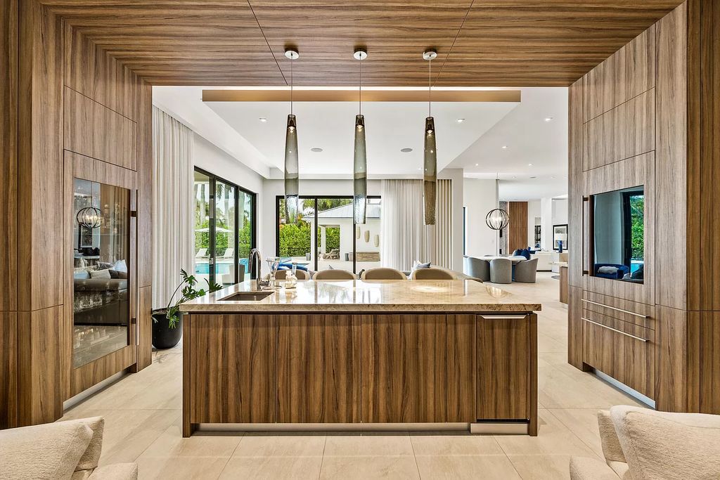 Nestled on the scenic Loxahatchee River, this 5-bedroom, 6-bathroom estate in Jupiter, Florida offers the epitome of luxury living.
