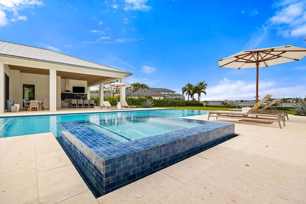 Nestled on the scenic Loxahatchee River, this 5-bedroom, 6-bathroom estate in Jupiter, Florida offers the epitome of luxury living.