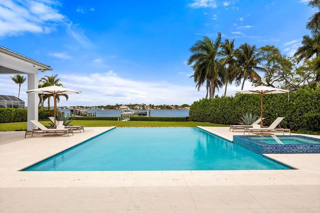 Nestled on the scenic Loxahatchee River, this 5-bedroom, 6-bathroom estate in Jupiter, Florida offers the epitome of luxury living.