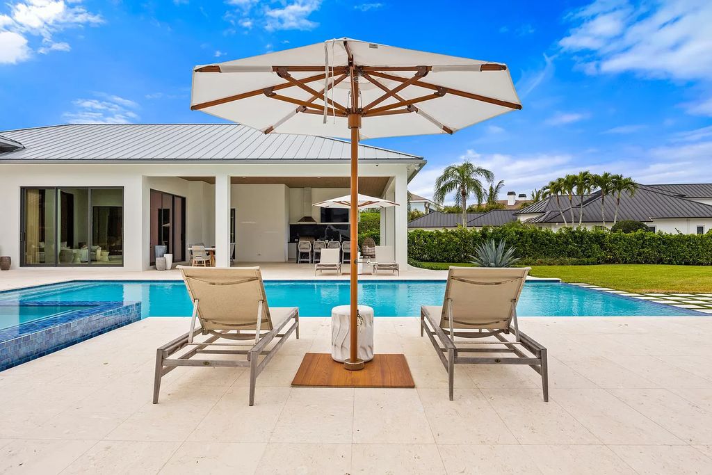 Nestled on the scenic Loxahatchee River, this 5-bedroom, 6-bathroom estate in Jupiter, Florida offers the epitome of luxury living.