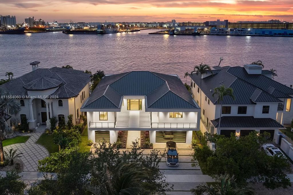 Experience unparalleled luxury living in this newly constructed modern waterfront estate located in Fort Lauderdale. With a Certificate of Occupancy issued and available turnkey, this stunning property boasts enchanting views of the intracoastal, ocean inlet, and passing cruise ships and yachts.