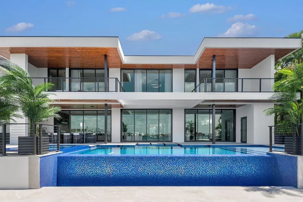 Experience unparalleled luxury living in this newly constructed modern waterfront estate located in Fort Lauderdale. With a Certificate of Occupancy issued and available turnkey, this stunning property boasts enchanting views of the intracoastal, ocean inlet, and passing cruise ships and yachts.