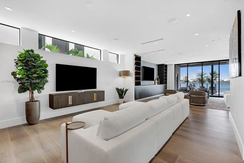 Experience unparalleled luxury living in this newly constructed modern waterfront estate located in Fort Lauderdale. With a Certificate of Occupancy issued and available turnkey, this stunning property boasts enchanting views of the intracoastal, ocean inlet, and passing cruise ships and yachts.