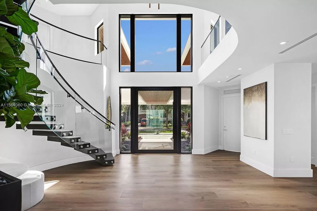 Experience unparalleled luxury living in this newly constructed modern waterfront estate located in Fort Lauderdale. With a Certificate of Occupancy issued and available turnkey, this stunning property boasts enchanting views of the intracoastal, ocean inlet, and passing cruise ships and yachts.