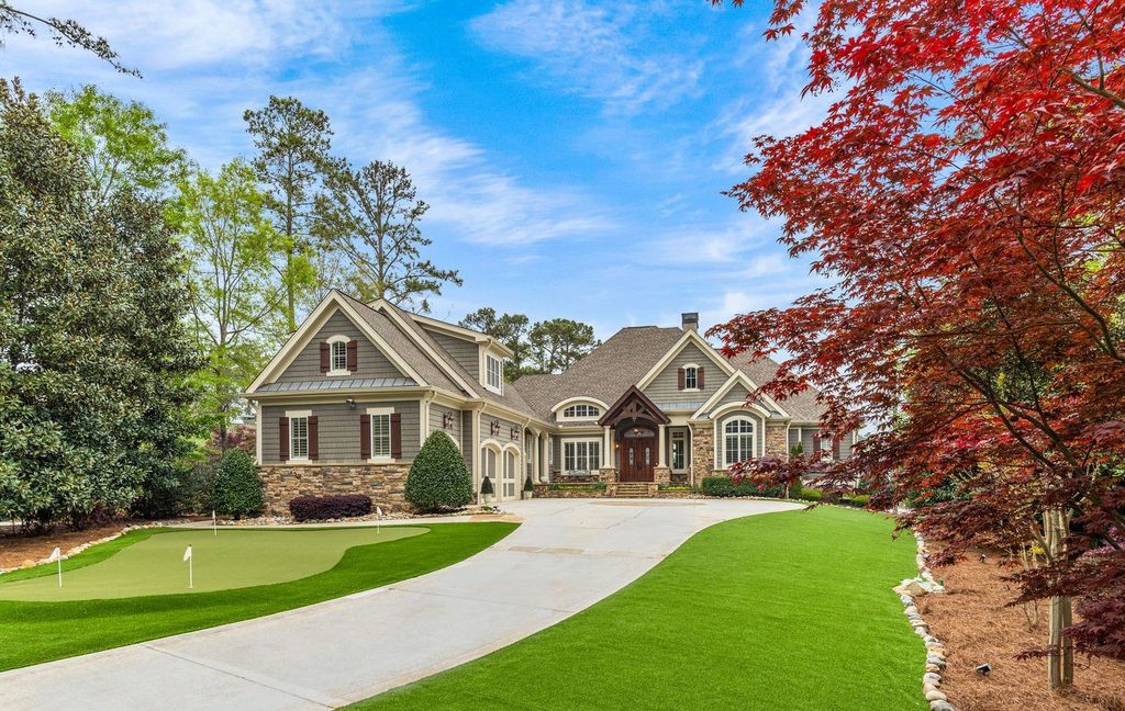 1461 North Shore Drive Home in Greensboro, Georgia. Discover unmatched luxury at this stunning family lake house near the Ritz and LakeClub. Enjoy expansive lake views, resort-style infinity pool, 4-car garage, spacious suites, two kitchens, and an elevator. 
