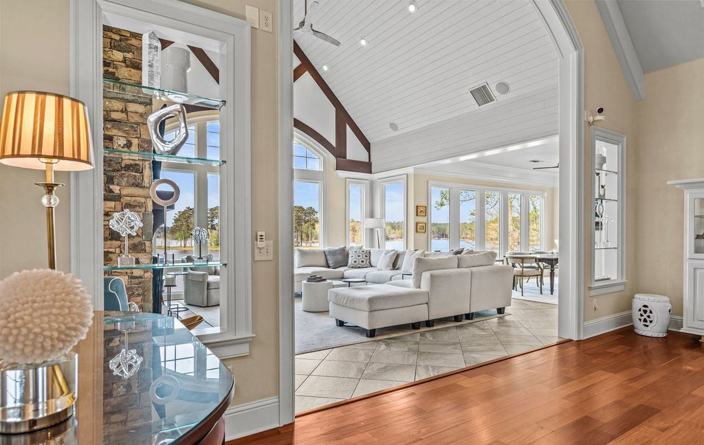 1461 North Shore Drive Home in Greensboro, Georgia. Discover unmatched luxury at this stunning family lake house near the Ritz and LakeClub. Enjoy expansive lake views, resort-style infinity pool, 4-car garage, spacious suites, two kitchens, and an elevator. 