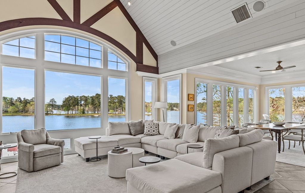 1461 North Shore Drive Home in Greensboro, Georgia. Discover unmatched luxury at this stunning family lake house near the Ritz and LakeClub. Enjoy expansive lake views, resort-style infinity pool, 4-car garage, spacious suites, two kitchens, and an elevator. 