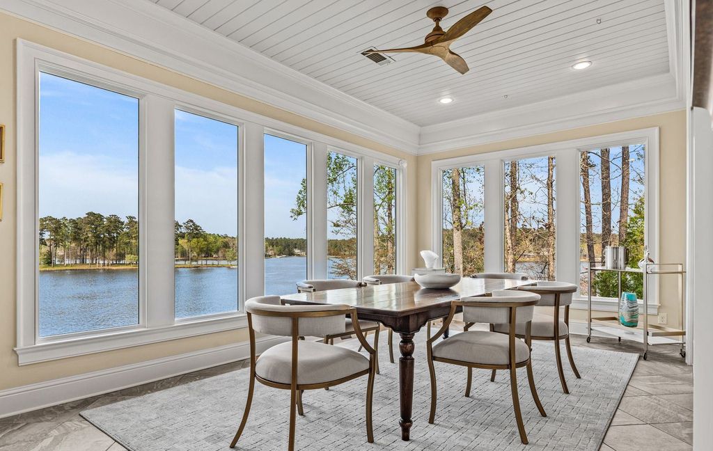 1461 North Shore Drive Home in Greensboro, Georgia. Discover unmatched luxury at this stunning family lake house near the Ritz and LakeClub. Enjoy expansive lake views, resort-style infinity pool, 4-car garage, spacious suites, two kitchens, and an elevator. 