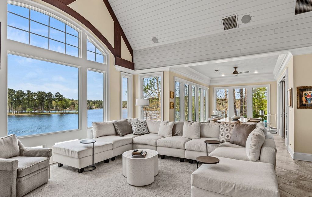 1461 North Shore Drive Home in Greensboro, Georgia. Discover unmatched luxury at this stunning family lake house near the Ritz and LakeClub. Enjoy expansive lake views, resort-style infinity pool, 4-car garage, spacious suites, two kitchens, and an elevator. 