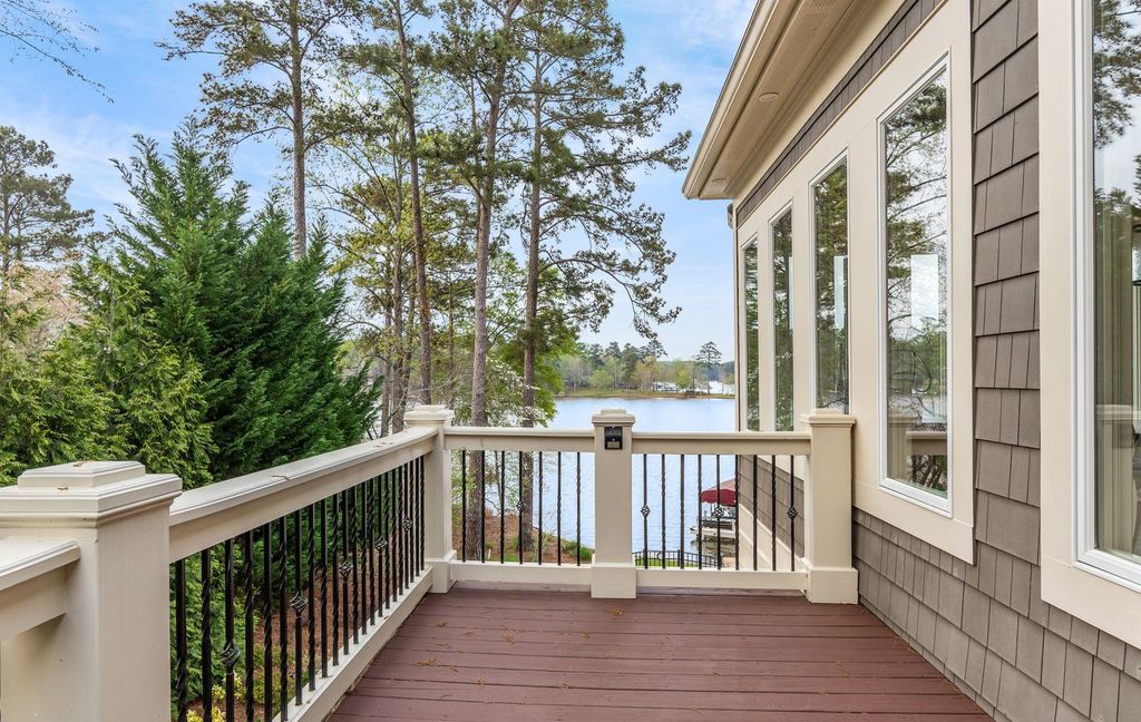 1461 North Shore Drive Home in Greensboro, Georgia. Discover unmatched luxury at this stunning family lake house near the Ritz and LakeClub. Enjoy expansive lake views, resort-style infinity pool, 4-car garage, spacious suites, two kitchens, and an elevator. 